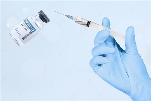 hand-holding-syringe-vaccine.jpg
